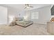 Main bedroom with neutral color scheme, plush carpet, and ceiling fan at 9281 Albus Hills Ave, Las Vegas, NV 89143