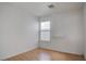 Bedroom featuring wood floors, a window with blinds, and a built-in shelf at 9290 Cool Creek Ave, Las Vegas, NV 89147