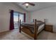 Spacious bedroom with a wooden bed frame and access to a private balcony at 9290 Cool Creek Ave, Las Vegas, NV 89147