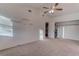 A neutral bedroom has floating shelves and a walk-in closet at 9290 Cool Creek Ave, Las Vegas, NV 89147