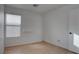 Bedroom with wood floors, a window with blinds, and a built-in shelf at 9290 Cool Creek Ave, Las Vegas, NV 89147