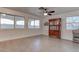 Bright and airy common area with a wooden display cabinet and large windows at 9290 Cool Creek Ave, Las Vegas, NV 89147