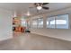 Open concept kitchen and living area with stainless steel appliances and concrete floors at 9290 Cool Creek Ave, Las Vegas, NV 89147