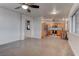 Open concept kitchen and living area with stainless steel appliances and concrete floors at 9290 Cool Creek Ave, Las Vegas, NV 89147