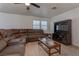 Spacious living room with sectional sofa and entertainment center at 9290 Cool Creek Ave, Las Vegas, NV 89147