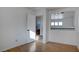 Upstairs loft area with wood floors overlooking the staircase and a view of the bathroom at 9290 Cool Creek Ave, Las Vegas, NV 89147