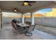 Covered patio with seating area and built-in BBQ at 9290 Cool Creek Ave, Las Vegas, NV 89147