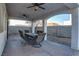 Covered patio with ample seating, perfect for outdoor dining and entertaining at 9290 Cool Creek Ave, Las Vegas, NV 89147