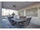 Covered patio with ceiling fans and outdoor dining set, overlooking the pool at 9290 Cool Creek Ave, Las Vegas, NV 89147