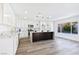 Modern kitchen with white cabinets and marble counters at 9541 Summersweet Ct, Las Vegas, NV 89123