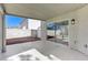 Covered patio with sliding glass door access, leading to a backyard at 9541 Summersweet Ct, Las Vegas, NV 89123