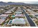 Aerial view of a residential neighborhood showcasing homes with pools and landscaping at 9705 Yellow Shadow Ave, Las Vegas, NV 89149