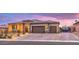 Single-story home with three-car garage and landscaped front yard at 9705 Yellow Shadow Ave, Las Vegas, NV 89149