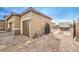 View of the home's exterior, including the garage and RV parking at 9705 Yellow Shadow Ave, Las Vegas, NV 89149