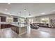 Open concept kitchen and living area with hardwood floors at 9705 Yellow Shadow Ave, Las Vegas, NV 89149