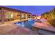 Relaxing pool area with fire pit and covered patio at 9705 Yellow Shadow Ave, Las Vegas, NV 89149