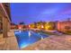 Luxury pool with waterfall features and lounge area at 9705 Yellow Shadow Ave, Las Vegas, NV 89149