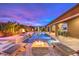 Modern pool and spa with fire pit and seating area at 9705 Yellow Shadow Ave, Las Vegas, NV 89149