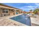 Stunning pool and patio with outdoor seating and fire pit at 9705 Yellow Shadow Ave, Las Vegas, NV 89149