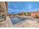 Resort-style pool with water features and lounge area at 9705 Yellow Shadow Ave, Las Vegas, NV 89149