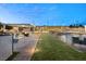 Outdoor kitchen, pergola, and expansive grassy area at 1121 Du Fort Hills Ct, Henderson, NV 89002