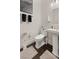 Elegant powder room with pedestal sink and dark floors at 1121 Du Fort Hills Ct, Henderson, NV 89002