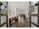 Bright and airy entryway with dark hardwood floors, offering a view of the spacious living area at 1121 Du Fort Hills Ct, Henderson, NV 89002