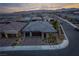 Modern home with a landscaped yard and two-car garage, aerial view at 11885 Grassy Plain Ave, Las Vegas, NV 89138