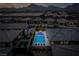 Night aerial view of community pool and homes at 11885 Grassy Plain Ave, Las Vegas, NV 89138