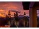 Backyard view at sunset with seating area and mountain backdrop at 11885 Grassy Plain Ave, Las Vegas, NV 89138