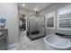 Spa-like bathroom with a walk-in shower and freestanding tub at 11885 Grassy Plain Ave, Las Vegas, NV 89138