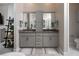 Modern bathroom with double vanity, gray cabinets, and a walk-in shower at 11885 Grassy Plain Ave, Las Vegas, NV 89138