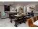 Farmhouse dining table with bench seating in open living area at 11885 Grassy Plain Ave, Las Vegas, NV 89138