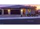 Modern home with two-car garage at sunset at 11885 Grassy Plain Ave, Las Vegas, NV 89138