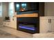 Modern electric fireplace with a sleek, black and wood design at 11885 Grassy Plain Ave, Las Vegas, NV 89138