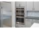 Built-in double oven and microwave in a modern kitchen at 11885 Grassy Plain Ave, Las Vegas, NV 89138