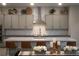 Modern kitchen with gray cabinets and quartz counters at 11885 Grassy Plain Ave, Las Vegas, NV 89138