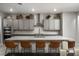 Large kitchen island with seating and modern gray cabinets at 11885 Grassy Plain Ave, Las Vegas, NV 89138