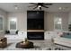 Living room with a stylish fireplace and built-in entertainment center at 11885 Grassy Plain Ave, Las Vegas, NV 89138