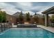 Relaxing pool and spa with fire pit and water features at 11885 Grassy Plain Ave, Las Vegas, NV 89138