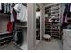 Large walk-in closet with washer and dryer, shelving, and hanging space at 11885 Grassy Plain Ave, Las Vegas, NV 89138