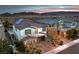 Aerial view of a lovely two-story home featuring a well-manicured front yard, solar panels, and a sparkling swimming pool at 12259 Pacific Cruise Ave, Las Vegas, NV 89138