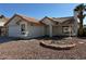 One story house with a two car garage and desert landscaping at 1275 White Dr, Las Vegas, NV 89119