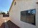 Side view of the house with a window and small yard at 1275 White Dr, Las Vegas, NV 89119