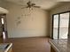 Living room with light walls, wood flooring and sliding glass doors at 1275 White Dr, Las Vegas, NV 89119