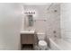 Updated bathroom with a shower/tub combo, white tile, and a modern vanity at 1309 Jimmy Ave, Las Vegas, NV 89106