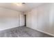 Bedroom featuring neutral walls, carpet floors, closet, and access to another room at 1309 Jimmy Ave, Las Vegas, NV 89106