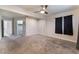 Bedroom featuring a ceiling fan, plush carpeting, neutral paint and access to a closet at 1309 Jimmy Ave, Las Vegas, NV 89106