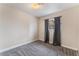 This bedroom features carpet floors, natural light, and neutral-colored walls at 1309 Jimmy Ave, Las Vegas, NV 89106