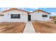 Exterior view of a single story home featuring a minimalist landscape at 1309 Jimmy Ave, Las Vegas, NV 89106